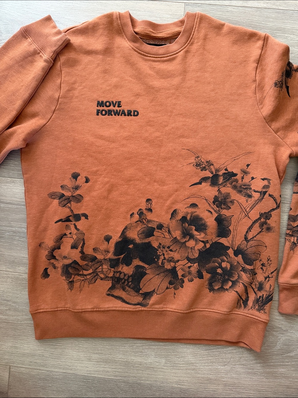 Burnt Orange 'Move Forward' Floral Skull Crewneck Sweater